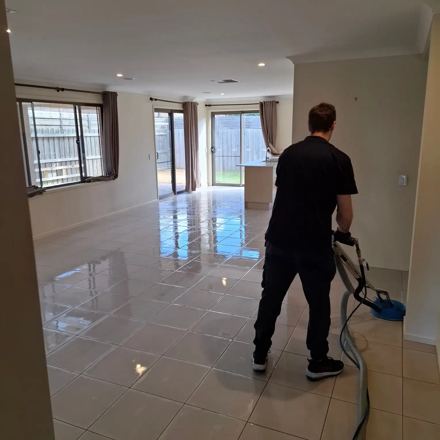 Rapid Dry Restoration technician professionally cleaning tiled flooring in Geelong
