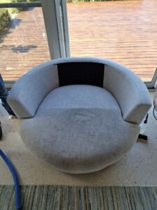 Upholstery Cleaning Geelong technician steam cleaning a fabric sofa