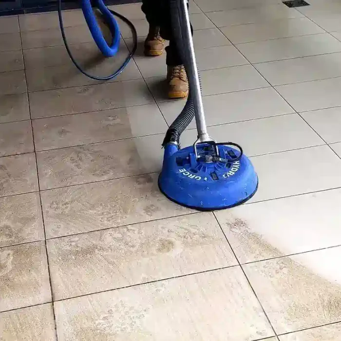 Professional tile and grout cleaning Geelong technician restoring a dirty kitchen floor